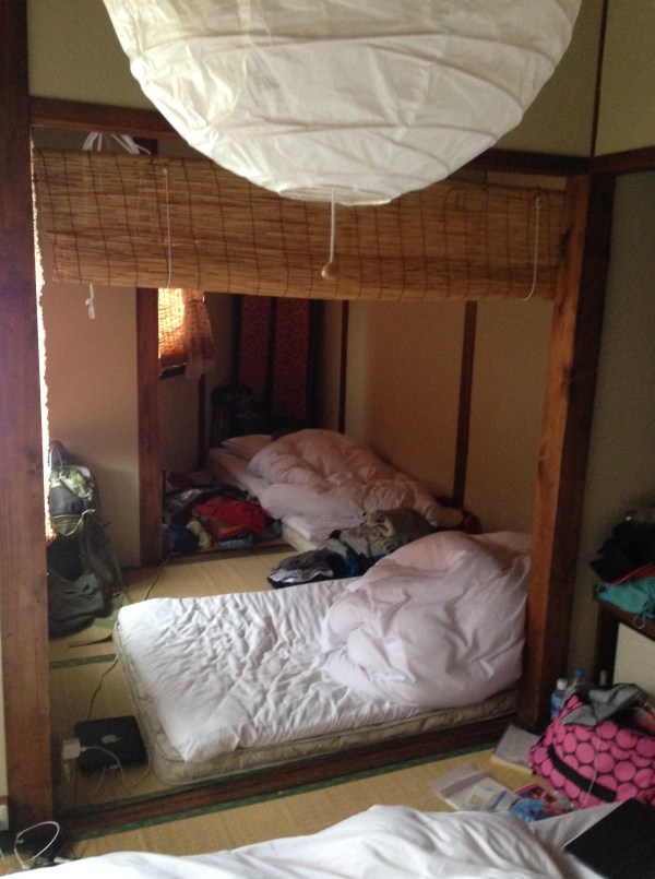 Cramped quarters! Our bedroom in Kanazawa...the kids are actually under the comforters!